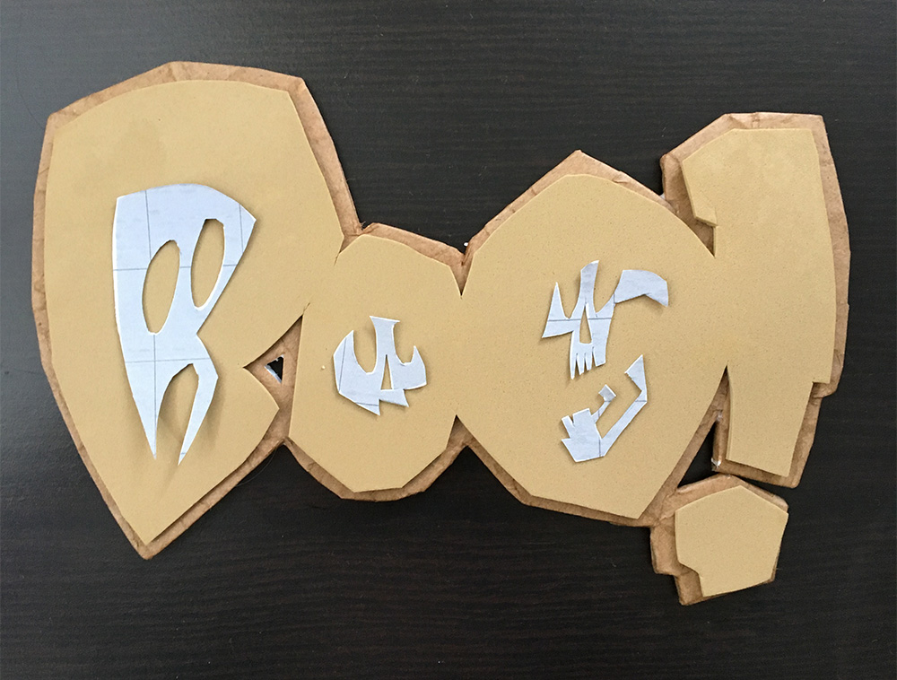 Haunted book sculpture - assembling the logo