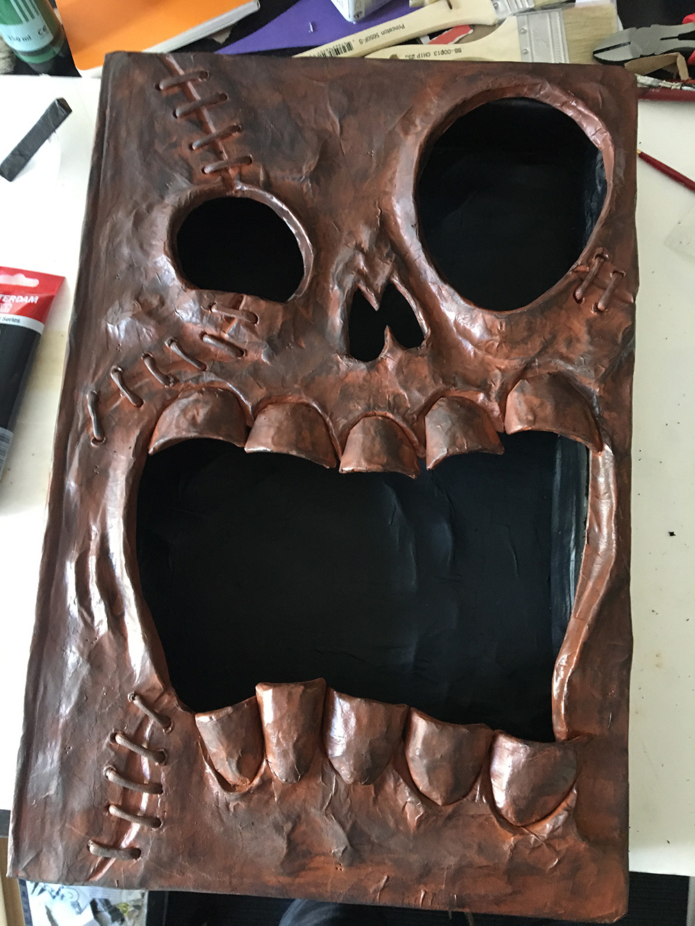 Haunted book sculpture - adding shadows with a sponge