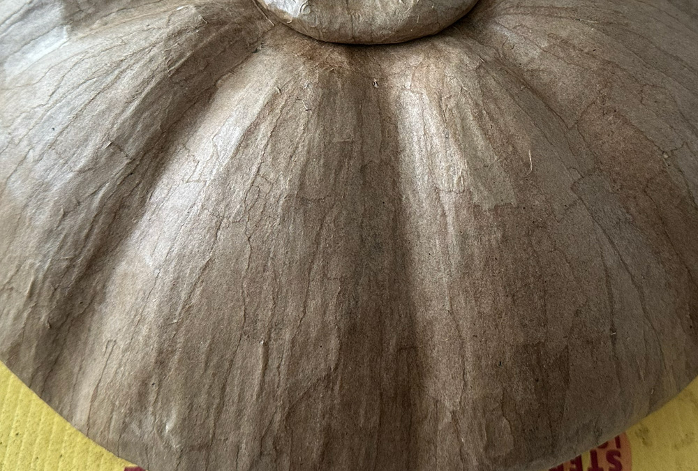 Close up of the smooth surface of the unpainted sculpture.