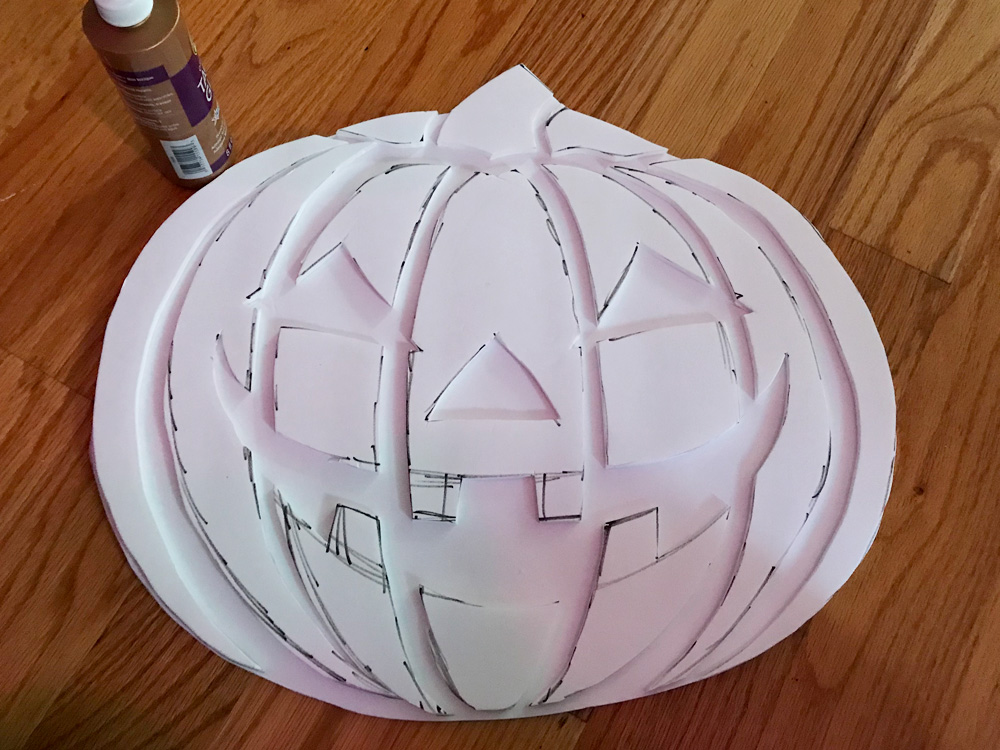Paper mache jack o' lantern lollipop prop - attaching the face