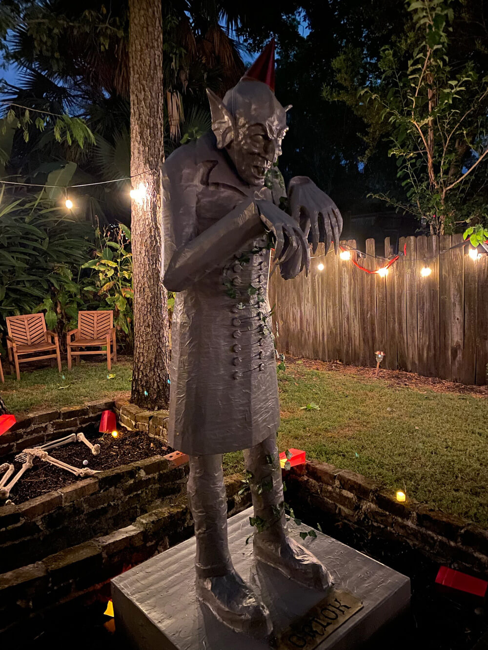 Count Orlok statue with fake ivy and party hat