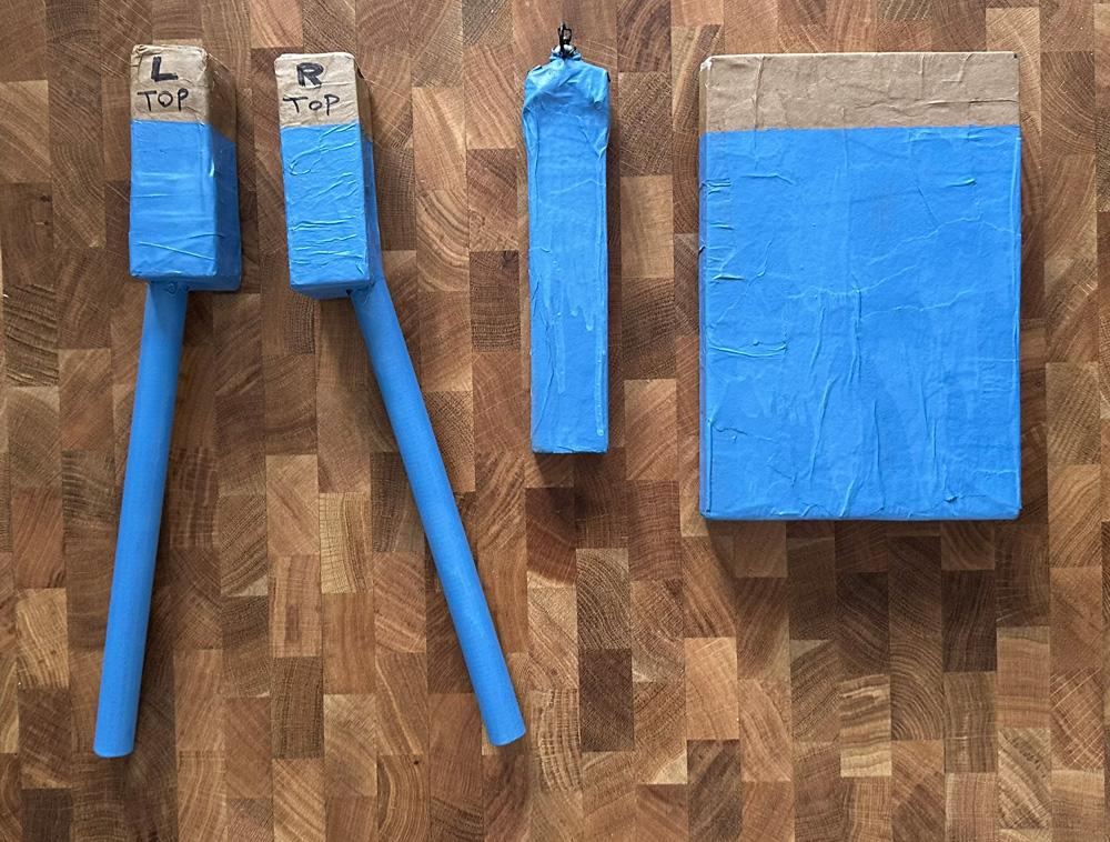 The four objects that will be inserted into the wall to make it wearable