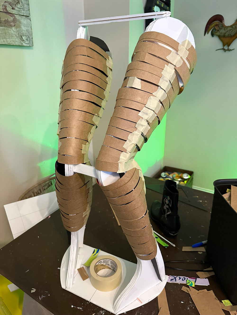The legs again, now covered in strips of paste board, looking more rounded and fleshed out