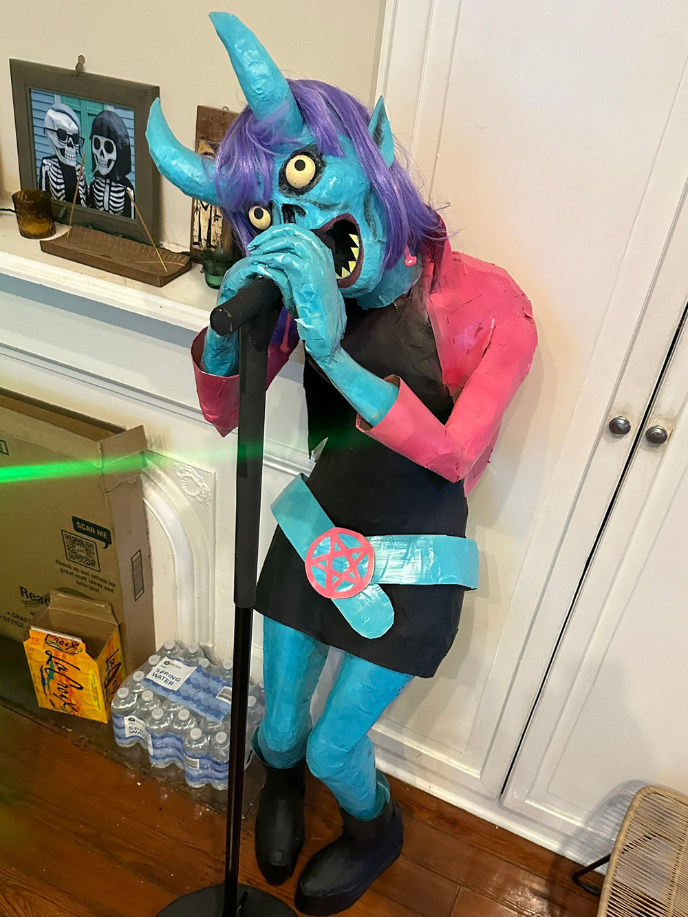 The demon singer lady pretty much completed, standing at her microphone; she does not yet have her guitar