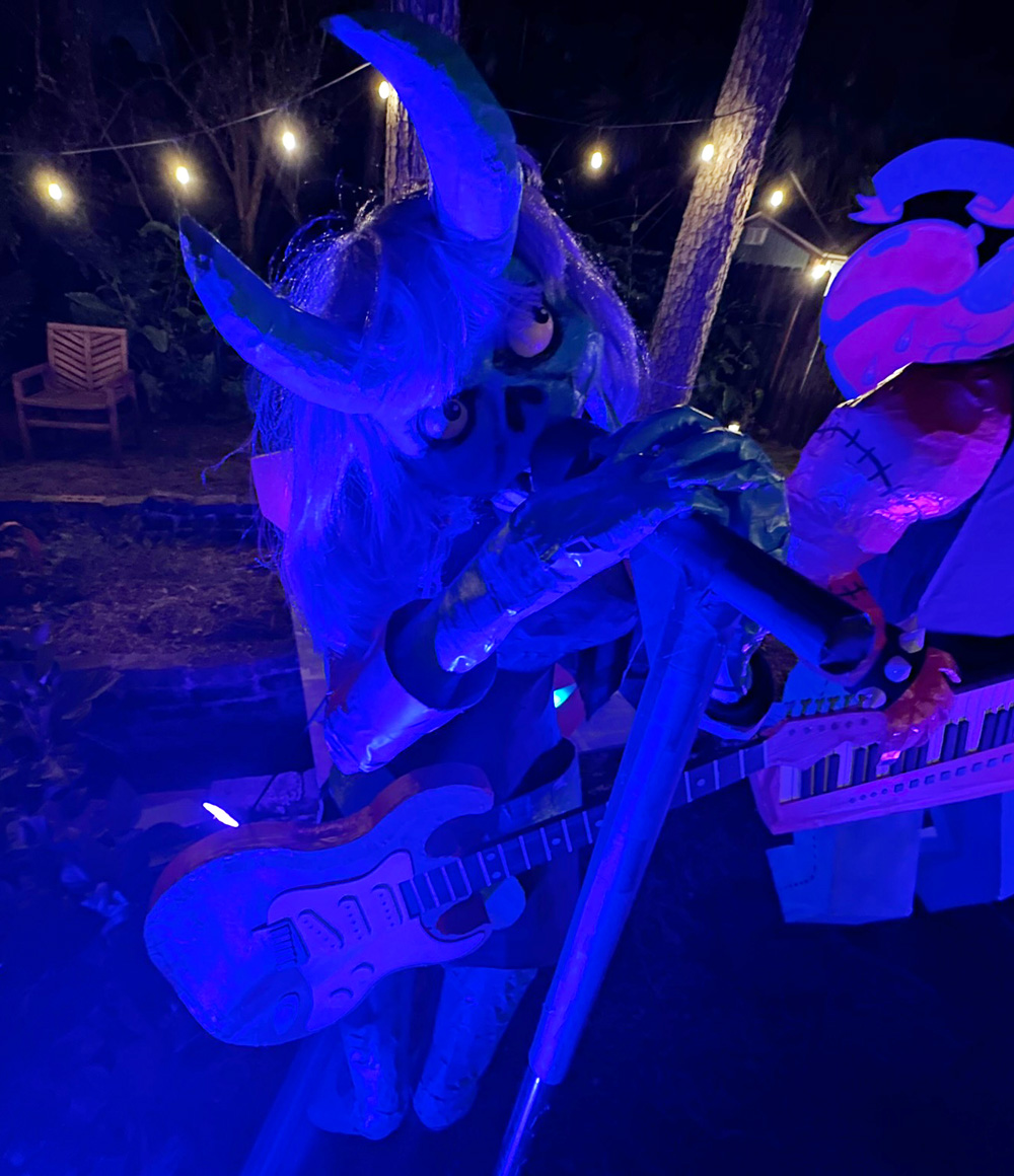 The demon singer lady in the spooky blue-purple lighting of our party
