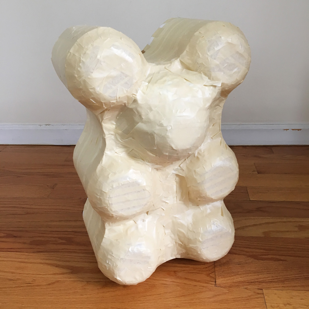 Giant paper mache gummi bears - adding a layer of masking tape