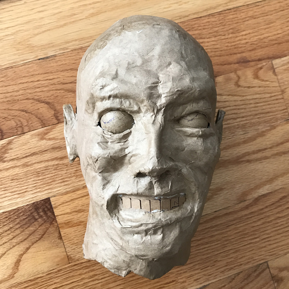 paper mache heads -- finishing the face