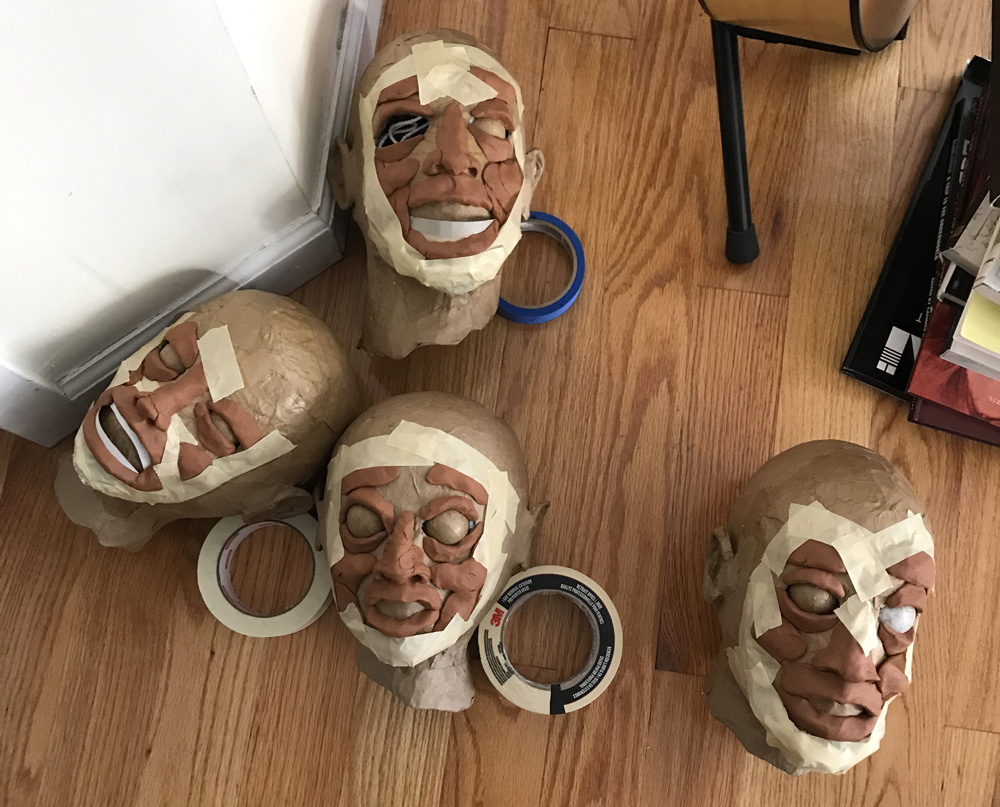 paper mache heads -- sculpting faces with clay