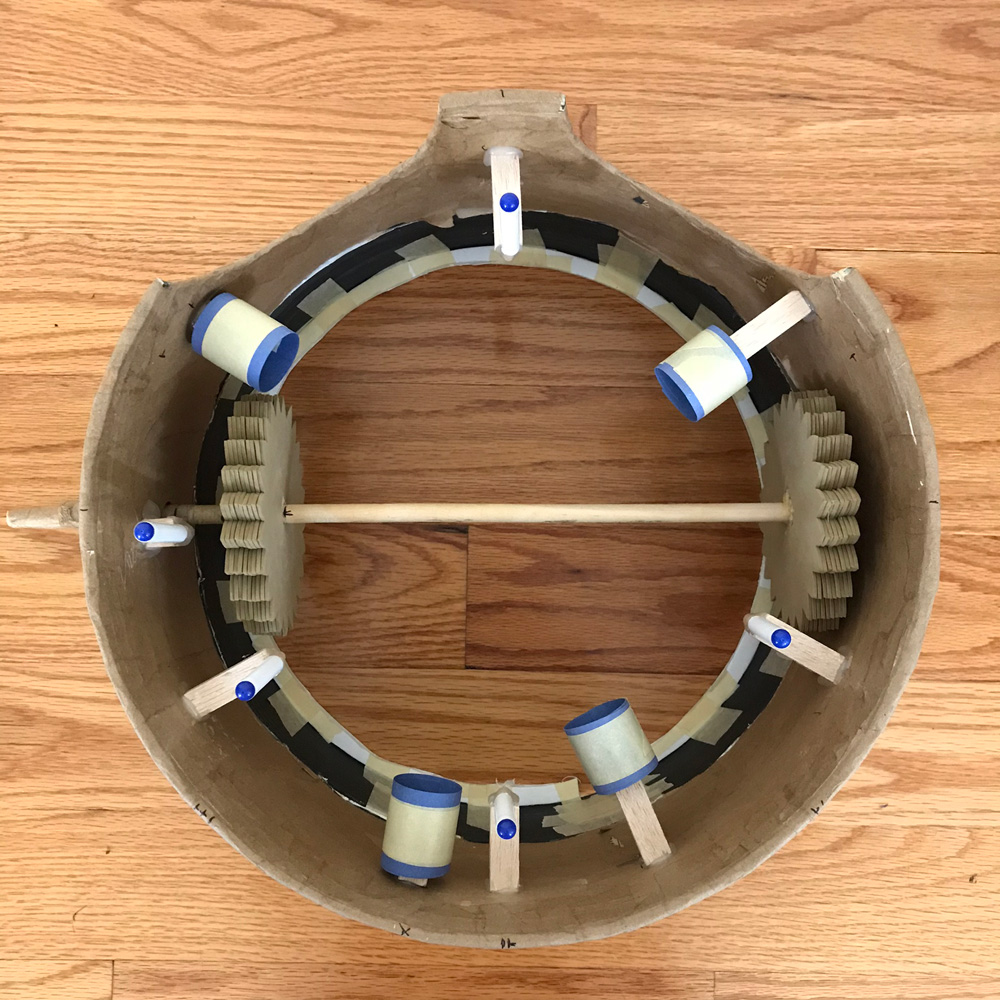 Assembled gears mechanism, minus rotating rings