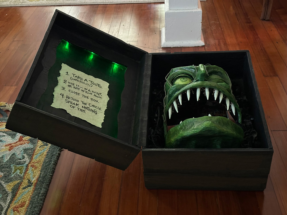 A view of the open box, it's sitting on the floor and we're viewing it from the bottom, like the witch is looking upward toward the ceiling.