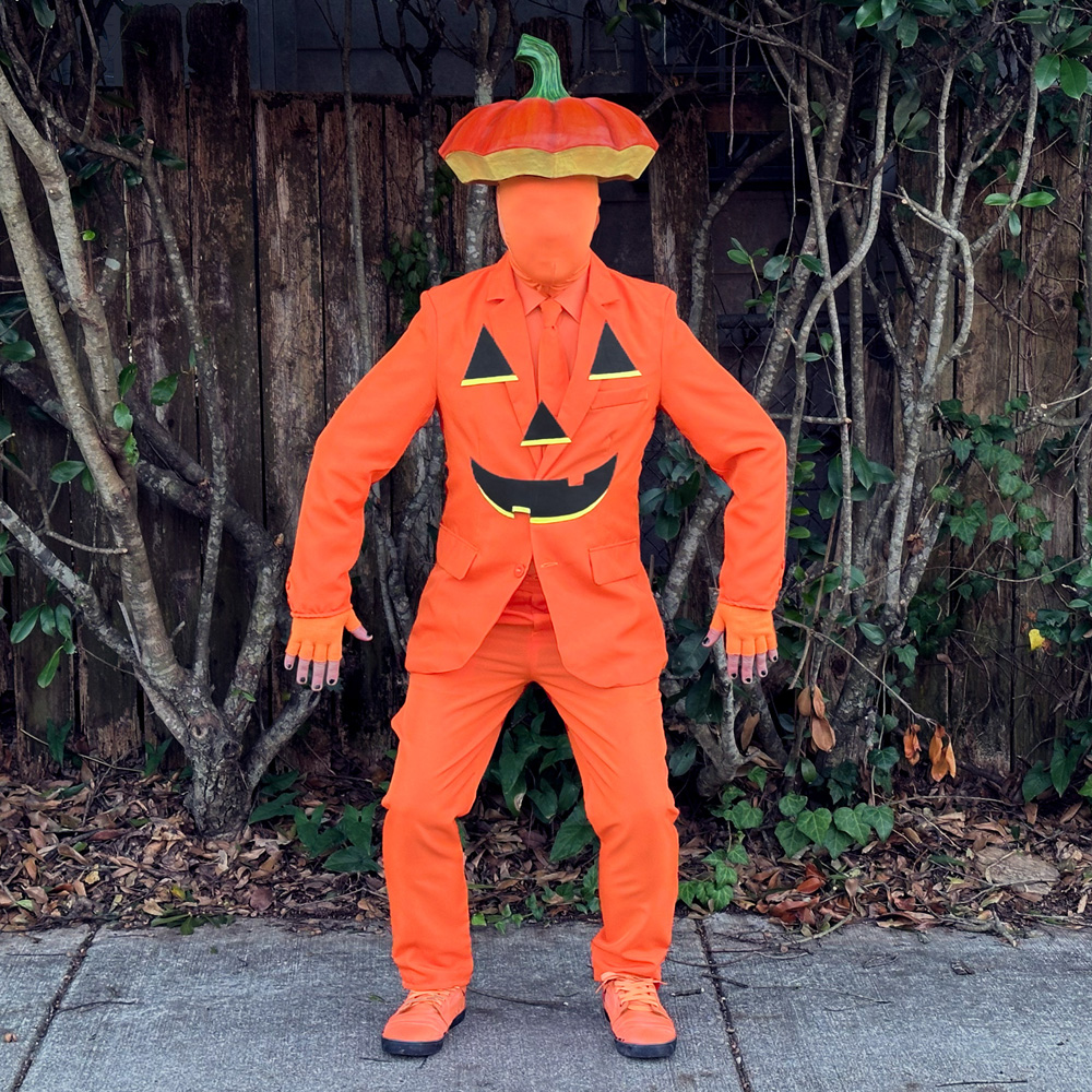 A wider shot of my whole jack o' lantern costume; you can see I'm wearing orange gloves and shoes as well!
