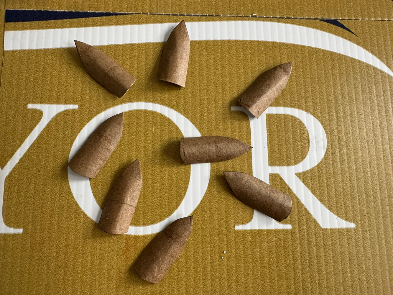 Cut out shapes representing fingernails.