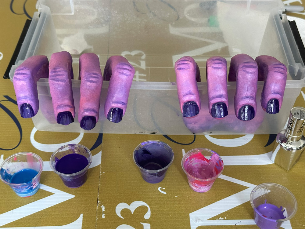 Painting progress; the paint job looks smoother now and the fingernails have been painted dark purple.