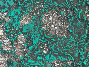 Not sure, really! Looks like thick green latex that was on the sidewalk but has somehow melted and become wrinkly like it oozed out of position somehow.